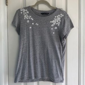 Grey t shirt with floral embellishments